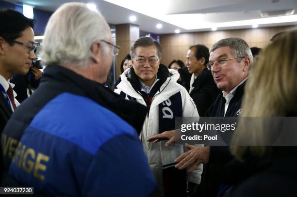 South Korean President Moon Jae-in, and International Olympic Committee President Thomas Bach, chat with King Carl XVI Gustaf of Sweden at the...