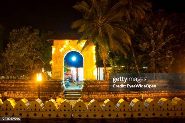 Local people and tourists visit the Sri Dalada Maligawa , the Temple of the Sacred Tooth Relic, a Buddhist temple on February 23, 2014 in Kandy, Sri...