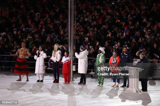 President of the International Olympic Committee Thomas Bach and Lee Hee-beom, President & CEO of PyeongChang Organizing Committee stand on the stage...
