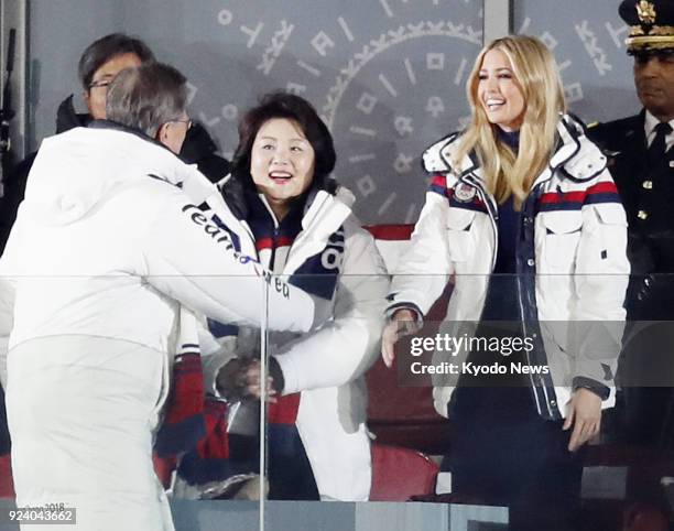 President Donald Trump's daughter and White House adviser Ivanka Trump shakes hands with South Korean President Moon Jae In during the closing...