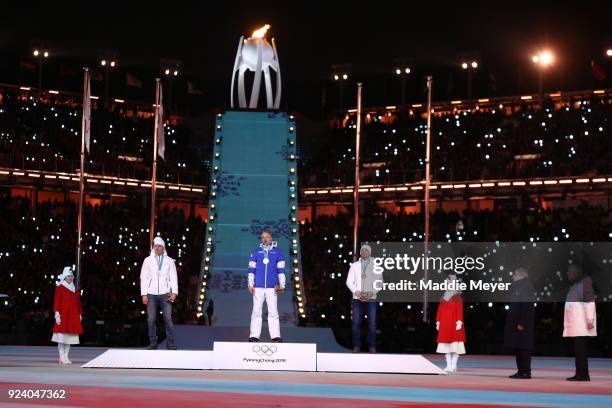 Silver medalist Aleksandr Bolshunov of Olympic Athlete from Russia, gold medalist Iivo Niskanen of Finland and bronze medalist Andrey Larkov of...