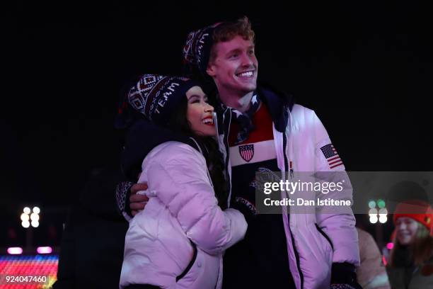 Madison Chock and Evan Bates walk with Team USA in the Parade of Athletes during the Closing Ceremony of the PyeongChang 2018 Winter Olympic Games at...