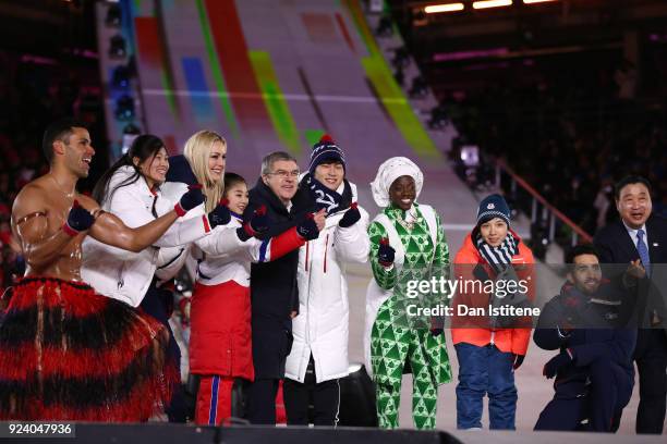 President of the International Olympic Committee Thomas Bach and Lee Hee-beom, President & CEO of PyeongChang Organizing Committee stand on the stage...