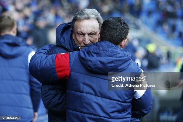 Bristol City manager Lee Johnson talks with Cardiff City manager Neil Warnock prior to kick off of the Sky Bet Championship match between Cardiff...