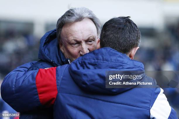 Bristol City manager Lee Johnson talks with Cardiff City manager Neil Warnock prior to kick off of the Sky Bet Championship match between Cardiff...