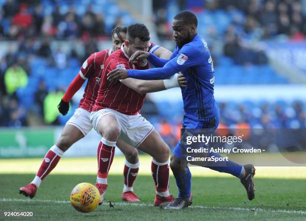 Bristol City's Bailey Wright vies for possession with Cardiff City's Junior Hoilett during the Sky Bet Championship match between Cardiff City and...