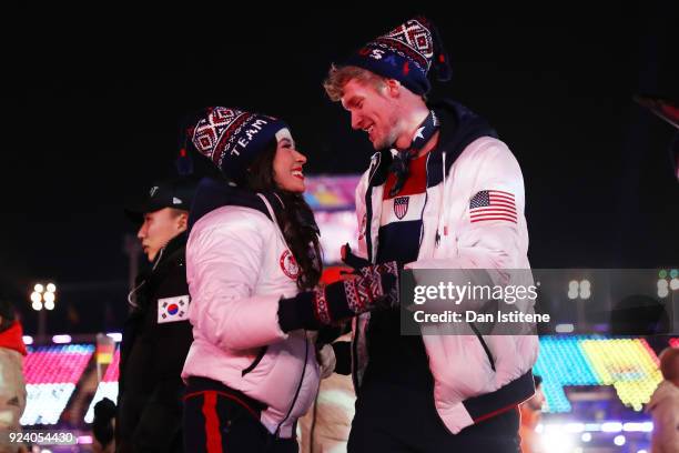 Madison Chock and Evan Bates of the United States walk with Team USA in the Parade of Athletes during the Closing Ceremony of the PyeongChang 2018...