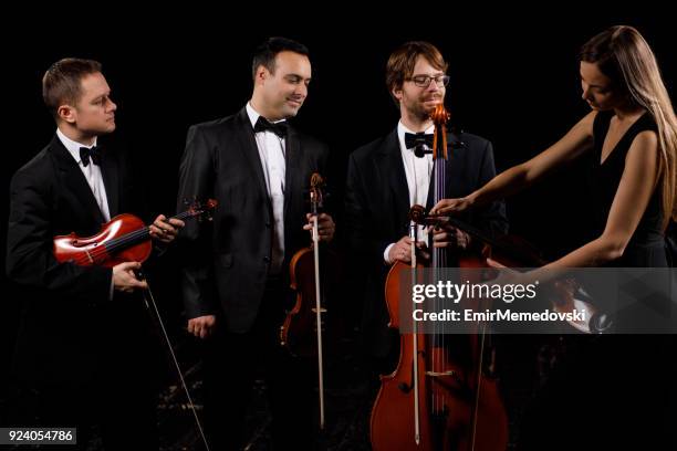 string quartet preparing for concert - string quartet stock pictures, royalty-free photos & images