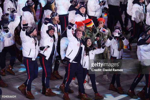 Madison Chock and Evan Bates of the United States walk with Team USA in the Parade of Athletes during the Closing Ceremony of the PyeongChang 2018...
