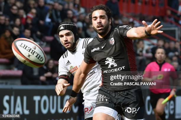 Toulouse's French winger Yoann Huget and Brive's French flyhalf Thomas Laranjeira run after the ball during the French Top 14 rugby union match...