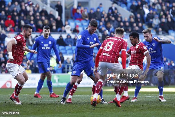 Gary Madine of Cardiff City struggles to find space as he is marked by Josh Brownhill of Bristol City during the Sky Bet Championship match between...