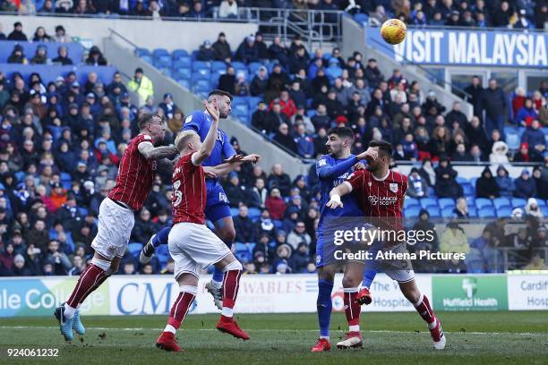 Gary Madine of Cardiff City is challenged by Horour Bjorgvin Magnusson of Bristol City during the Sky Bet Championship match between Cardiff City and...