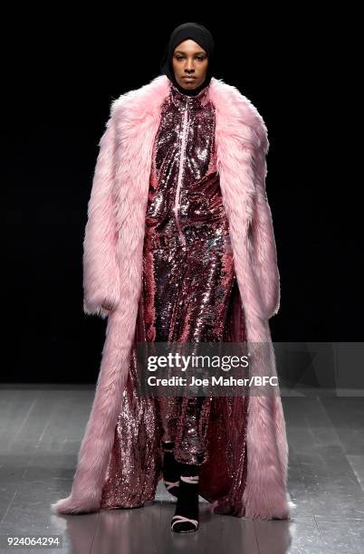 Model walks the catwalk at the Juicy Couture show during the London Fashion Week Festival February 2018 on February 25, 2018 in London, United...