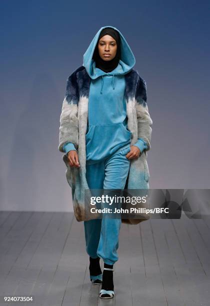 Model walks the catwalk at the Juicy Couture show during the London Fashion Week Festival February 2018 on February 25, 2018 in London, United...