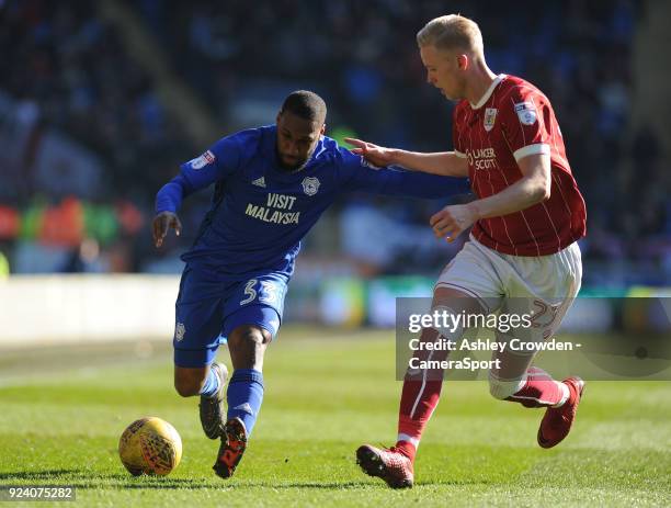 Cardiff City's Junior Hoilett vies for possession with Bristol City's Hordur Magnusson during the Sky Bet Championship match between Cardiff City and...