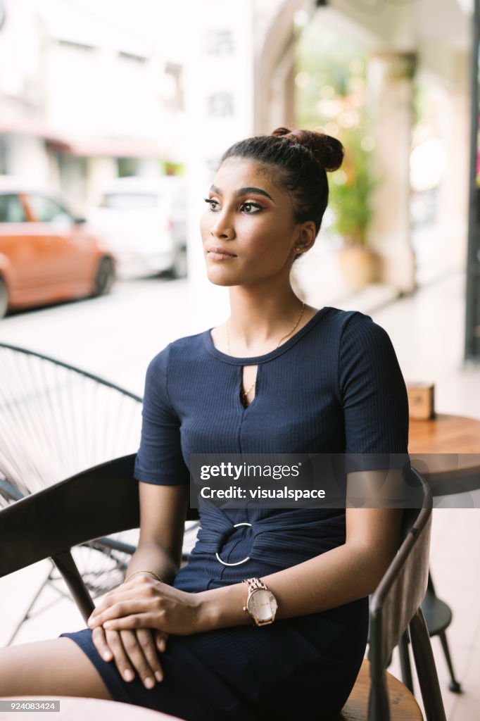 Businesswoman in a sidewalk cafe