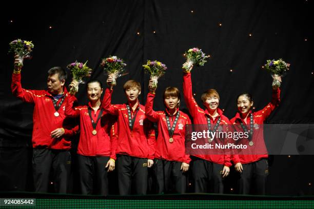 Yuling, WANG ManyuCHEN Xingtong, DING Ning, LIU Shiwen, and the coach LI Sun - China women team is cheering and is receiving gold medals after...