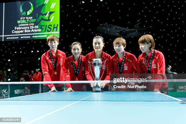 Yuling, WANG ManyuCHEN Xingtong, DING Ning, LIU Shiwen, and the coach LI Sun - China women team is cheering and is receiving gold medals after...