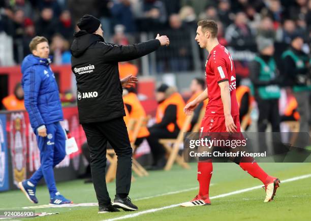 Head coach Heiko Herrlich cares of Dominik Kohr of Leverkusen after being sent off the pitch getting a yellow red card during the Bundesliga match...