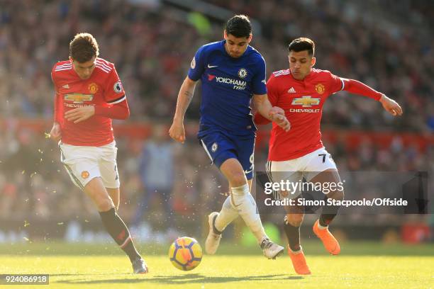 Alvaro Morata of Chelsea battles with Victor Lindelof of Man Utd and Alexis Sanchez of Man Utd during the Premier League match between Manchester...