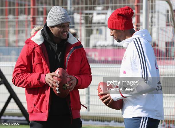 Jerome Boateng of FC Bayern Muenchen performs with NFL player Deshaun Watson of Houston Texans after a training session at the club's Saebener...