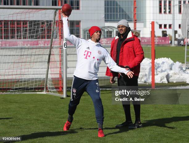 Jerome Boateng of FC Bayern Muenchen performs with NFL player Deshaun Watson of Houston Texans after a training session at the club's Saebener...