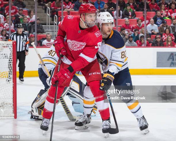 Anthony Mantha of the Detroit Red Wings sets up in front of the net next to Nathan Beaulieu of the Buffalo Sabres during an NHL game at Little...