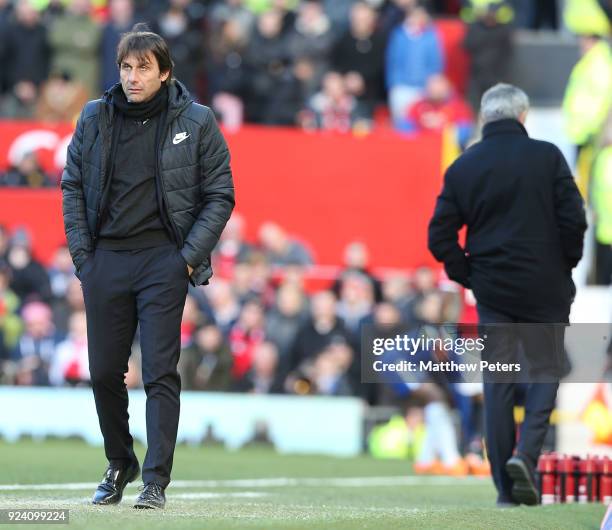Manager Jose Mourinho of Manchester United and Manager Antonio Conte of Chelsea watch from the touchline during the Premier League match between...