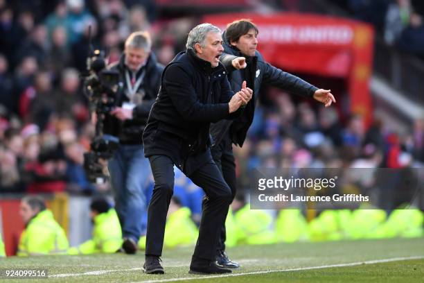 Jose Mourinho, Manager of Manchester United and Antonio Conte, Manager of Chelsea give their teams instuctions during the Premier League match...