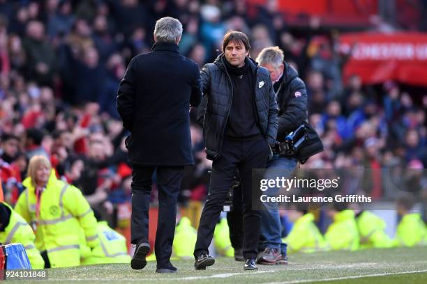 Jose Mourinho, Manager of Manchester United and Antonio Conte, Manager of Chelsea shake hands after the Premier League match between Manchester...