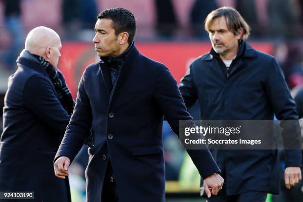 Assistant trainer Jan Wouters of Feyenoord, coach Giovanni van Bronckhorst of Feyenoord, coach Phillip Cocu of PSV during the Dutch Eredivisie match...