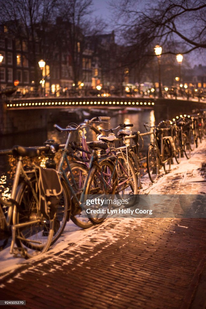Bicycles at night in winter in Amsterdam