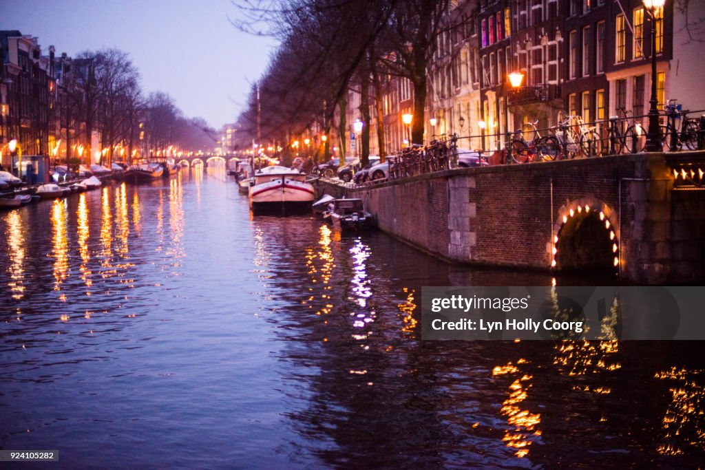 Amsterdam canal in winter at night