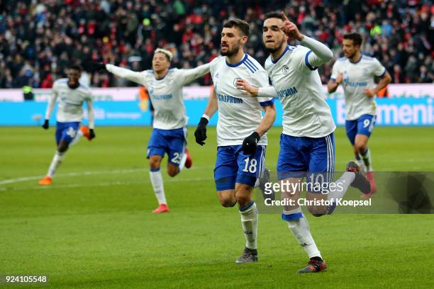 Nabil Bentaleb celebrates the second goal with Daniel Caligiuri of Schalke celebrates the first goal during the Bundesliga match between Bayer 04...
