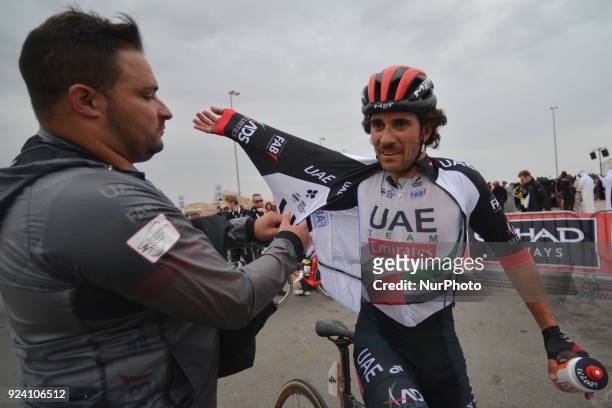 Italy's Roberto Ferrari from UAE Team Emirates helped getting dressed at the end of the fifth and final stage of the 2018 Abu Dhabi Tour, the 199km...