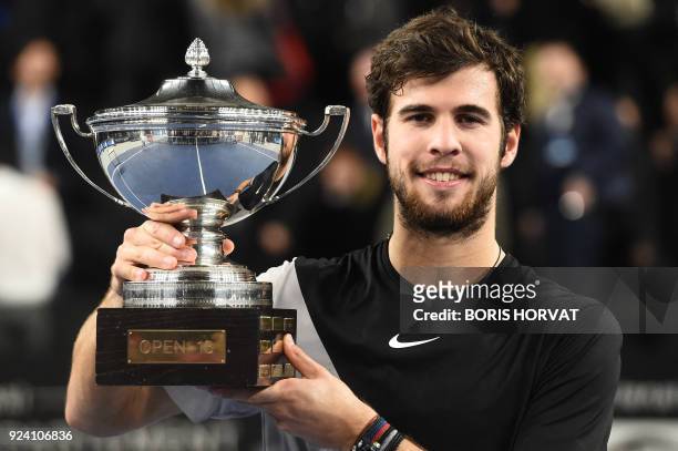 Russian Karen Khachanov poses with the trophy after winning against Frenchman Lucas Pouille during the final match of the ATP Marseille Open 13...