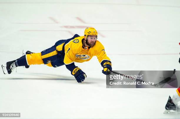 Yannick Weber of the Nashville Predators goes after the puck against the Calgary Flames during an NHL game at Bridgestone Arena on February 15, 2018...