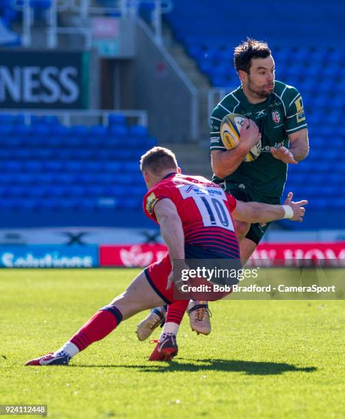 London Irish's James Marshall evades the tackle of Worcester Warriors' Jamie Shillcock during the Aviva Premiership match between London Irish and...