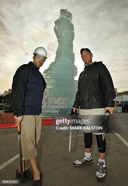 Ice sculptors Kevin Roscoe and Peter Slavin pose for photographers after breaking the Guinness World Record for the Tallest Ice Sculpture with their...