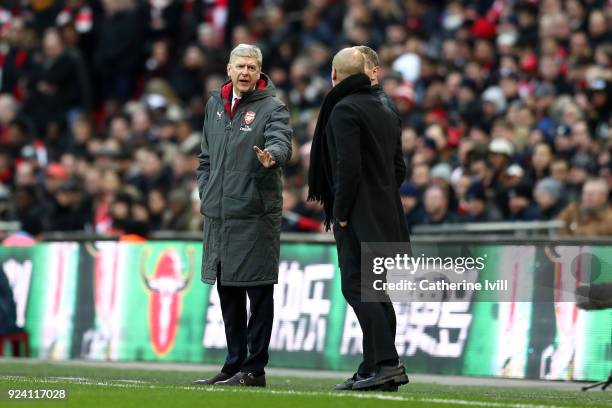 Arsene Wenger, Manager of Arsenal and Josep Guardiola, Manager of Manchester City argue during the Carabao Cup Final between Arsenal and Manchester...