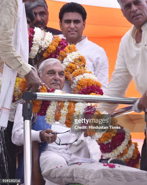 Former Chief Minister Bhupinder Singh Hooda welcomed by party workers during the Jan-Kranti Rath Yatra Rally at Hodal Mandi, on February 25, 2018 in...
