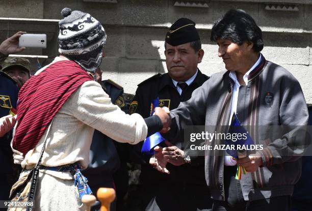 Boliva's president Evo Morales shakes hands with Rodolfo Choque, Army's lieutenant, playing as messenger Gregorio Collque "Goyo" who reported in 1879...