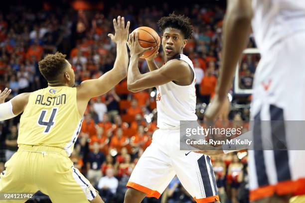 De'Andre Hunter of the Virginia Cavaliers looks to pass around Brandon Alston of the Georgia Tech Yellow Jackets in the second half during a game at...