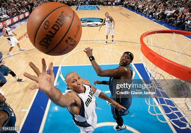 Shawn Marion of the Dallas Mavericks puts in a layup against Andray Blatche of the Washington Wizards during the season opener at the American...