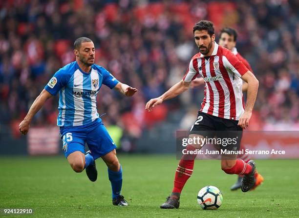 Medhi Lacen of Malaga CF competes for the ball with Raul Garcia of Athletic Club during the La Liga match between Athletic Club Bilbao and Malaga CF...