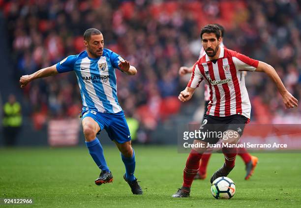 Medhi Lacen of Malaga CF competes for the ball with Raul Garcia of Athletic Club during the La Liga match between Athletic Club Bilbao and Malaga CF...