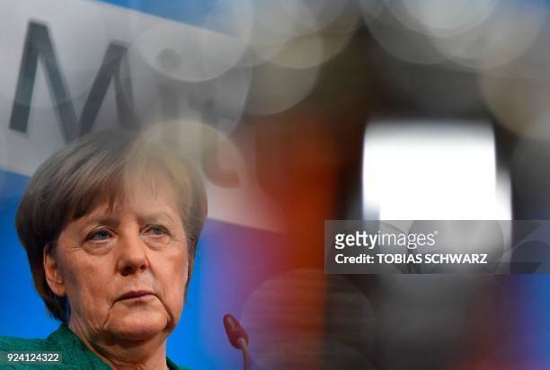 German Chancellor Angela Merkel, also leader of Germany's conservative Christian Democratic Union party, gives a press conference following sessions...