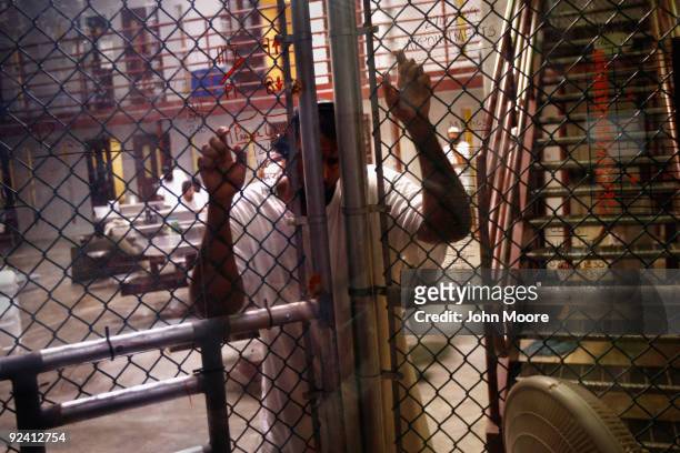 Detainee stands at an interior fence inside the U.S. Military prison for "enemy combatants" on October 27, 2009 in Guantanamo Bay, Cuba. Although...