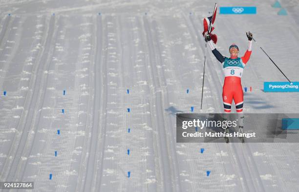 Marit Bjoergen of Norway celebrates winning the Ladies' 30km Mass Start Classic on day sixteen of the PyeongChang 2018 Winter Olympic Games at...