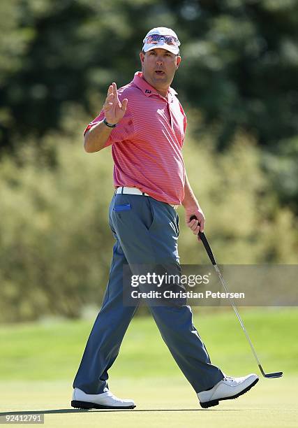 Bob Heintz reacts to the crowd after making a putt on the second hole green during the third round of the Frys.com Open at Grayhawk Golf Club on...